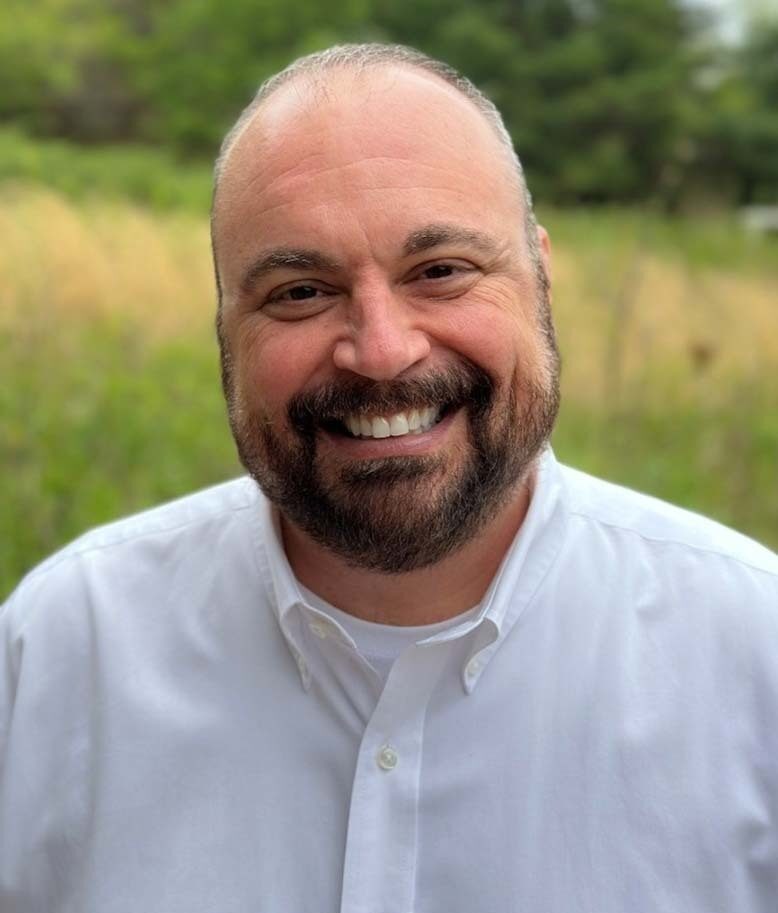 Wall Residences HR & Payroll director Clay McCoy standing outside