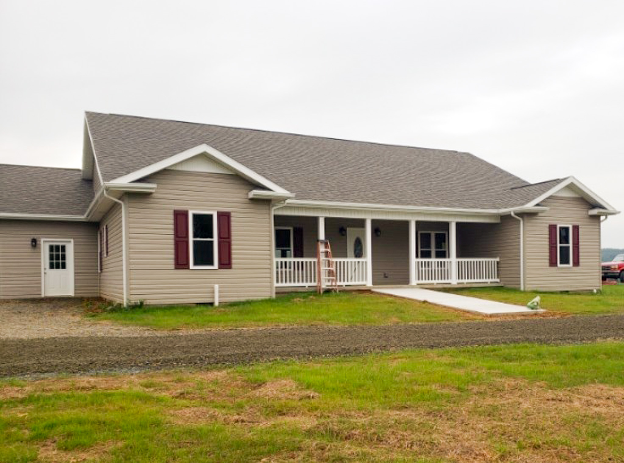Single-story beige house with a front porch, ramp, and large yard belonging to group home provider Mary Henley in Woodlawn, Virginia.